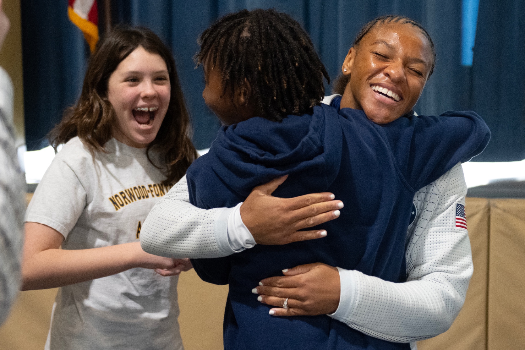 Ariana Ramsey hugging a student after a school talk